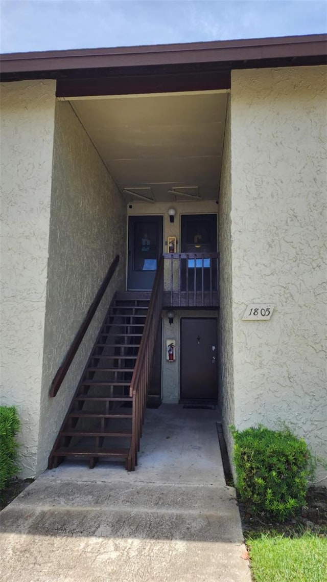 4215 E Bay Dr Unit 1805B, Clearwater, FL 33764 - doorway to property with stucco siding