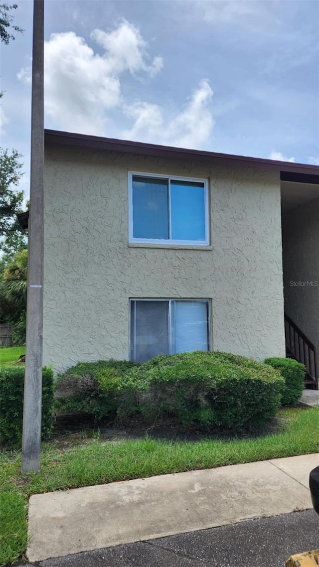 4215 E Bay Dr Unit 1805B, Clearwater, FL 33764 - view of side of property with stucco siding