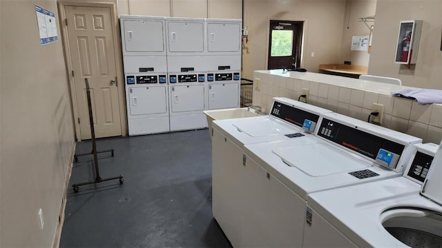 4215 E Bay Dr Unit 1805B, Clearwater, FL 33764 - communal laundry room with stacked washer / dryer and washing machine and dryer