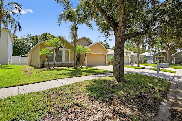 13040 Waterbourne Dr, Gibsonton, FL 33534 - single story home with driveway, a garage, and stucco siding