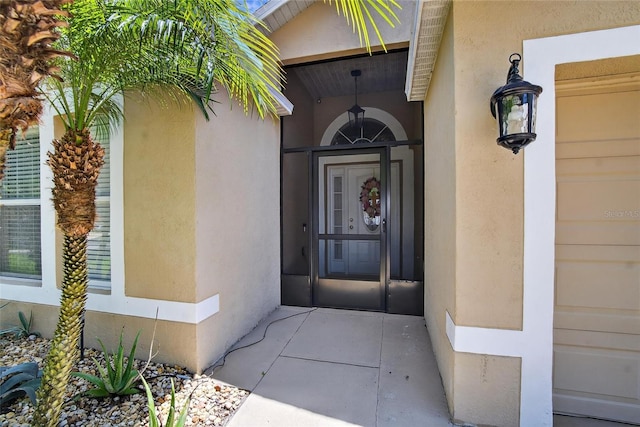 13040 Waterbourne Dr, Gibsonton, FL 33534 - doorway to property featuring stucco siding