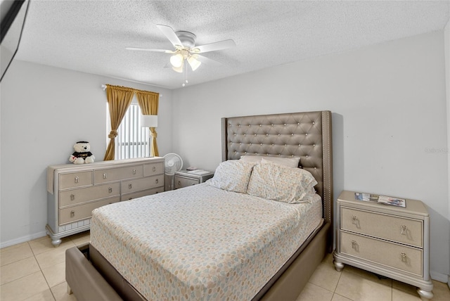 13040 Waterbourne Dr, Gibsonton, FL 33534 - bedroom featuring light tile patterned floors, a textured ceiling, and a ceiling fan