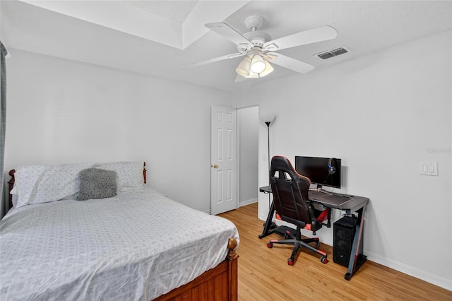 13040 Waterbourne Dr, Gibsonton, FL 33534 - bedroom featuring light wood finished floors, an office area, and a ceiling fan