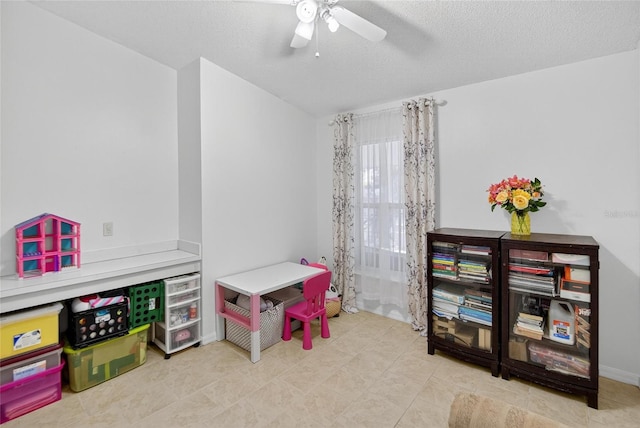 13040 Waterbourne Dr, Gibsonton, FL 33534 - playroom with a ceiling fan, a textured ceiling, and tile patterned flooring