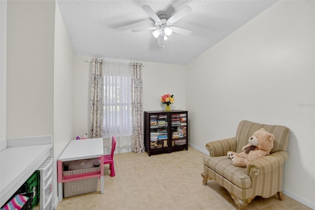13040 Waterbourne Dr, Gibsonton, FL 33534 - living area featuring a ceiling fan and a textured ceiling