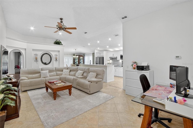13040 Waterbourne Dr, Gibsonton, FL 33534 - living area featuring a ceiling fan, light tile patterned flooring, arched walkways, recessed lighting, and a chandelier