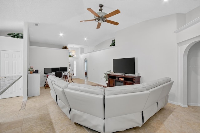 13040 Waterbourne Dr, Gibsonton, FL 33534 - living room with arched walkways, a ceiling fan, lofted ceiling, recessed lighting, and light tile patterned flooring