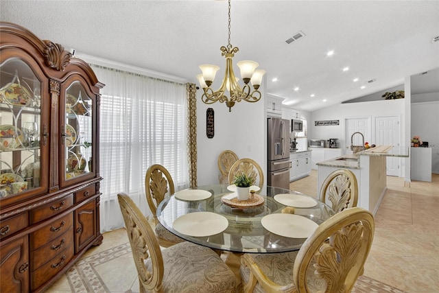 13040 Waterbourne Dr, Gibsonton, FL 33534 - dining area with a chandelier and vaulted ceiling