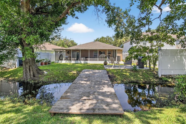 13040 Waterbourne Dr, Gibsonton, FL 33534 - rear view of house with a sunroom