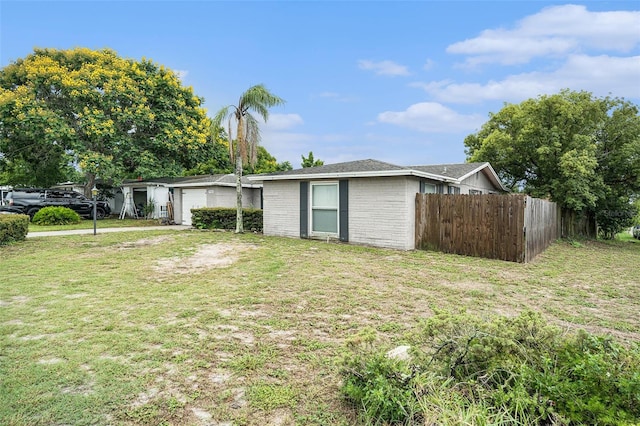 7510 Tyson Dr, Port Richey, FL 34668 - view of front of home with a garage and brick siding