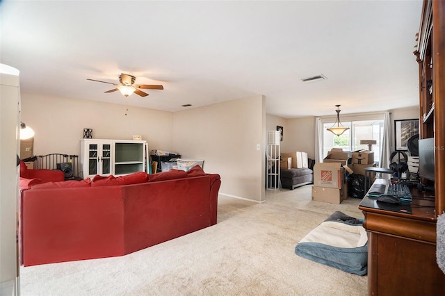 7510 Tyson Dr, Port Richey, FL 34668 - carpeted living room featuring ceiling fan and baseboards