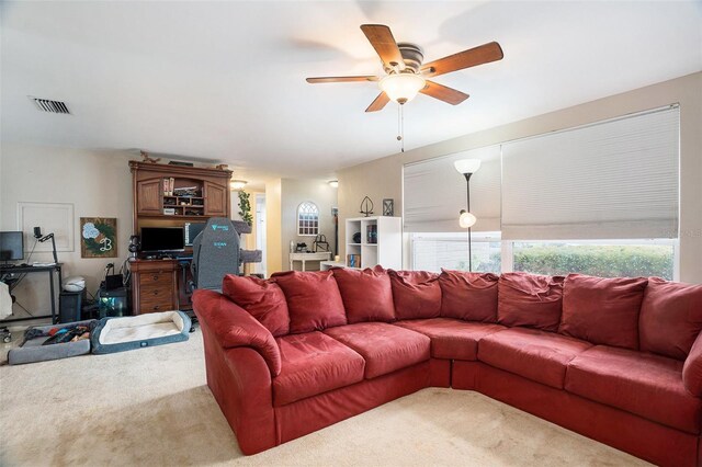 7510 Tyson Dr, Port Richey, FL 34668 - carpeted living room with an office area and ceiling fan