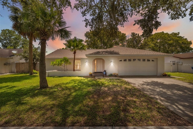 4236 Woodtrail Blvd, New Port Richey, FL 34653 - single story home featuring a garage, concrete driveway, and stucco siding