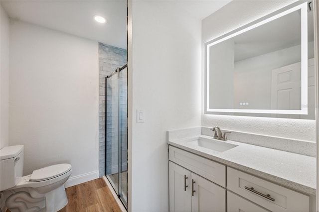 4236 Woodtrail Blvd, New Port Richey, FL 34653 - full bathroom featuring a stall shower, vanity, wood finished floors, and recessed lighting