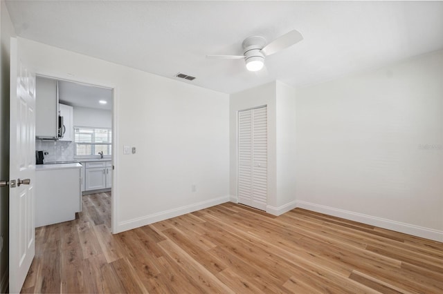 4236 Woodtrail Blvd, New Port Richey, FL 34653 - unfurnished room featuring ceiling fan and light wood-type flooring