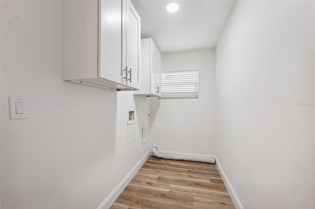 4236 Woodtrail Blvd, New Port Richey, FL 34653 - laundry room with cabinet space, light wood finished floors, hookup for a washing machine, and recessed lighting