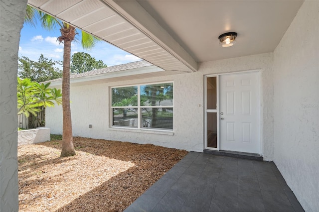 4236 Woodtrail Blvd, New Port Richey, FL 34653 - view of exterior entry with stucco siding