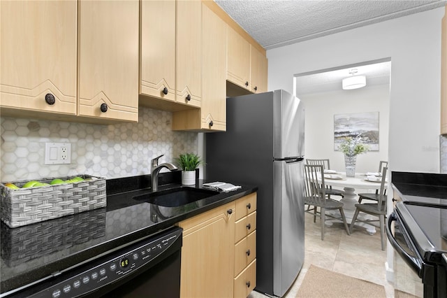 3325 Bayshore Blvd Unit E14, Tampa, FL 33629 - kitchen with dishwasher, backsplash, range with electric cooktop, freestanding refrigerator, and a textured ceiling