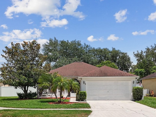 501 Royal Ridge St, Valrico, FL 33594 - view of front of house with stucco siding, concrete driveway, and a garage