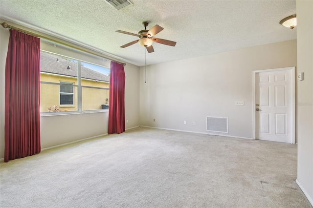 501 Royal Ridge St, Valrico, FL 33594 - unfurnished room with ceiling fan, carpet floors, and a textured ceiling