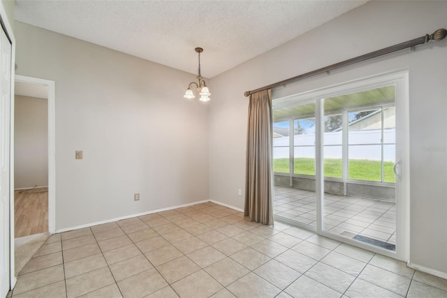 501 Royal Ridge St, Valrico, FL 33594 - spare room with a chandelier, light tile patterned floors, and a textured ceiling