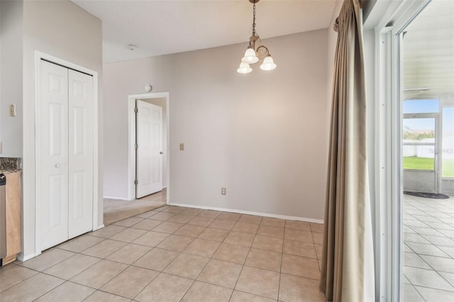 501 Royal Ridge St, Valrico, FL 33594 - unfurnished dining area with a chandelier and light tile patterned floors