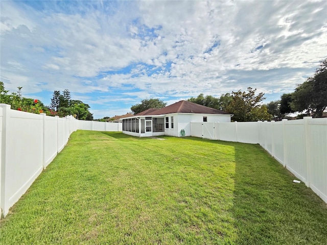 501 Royal Ridge St, Valrico, FL 33594 - fenced backyard with a sunroom