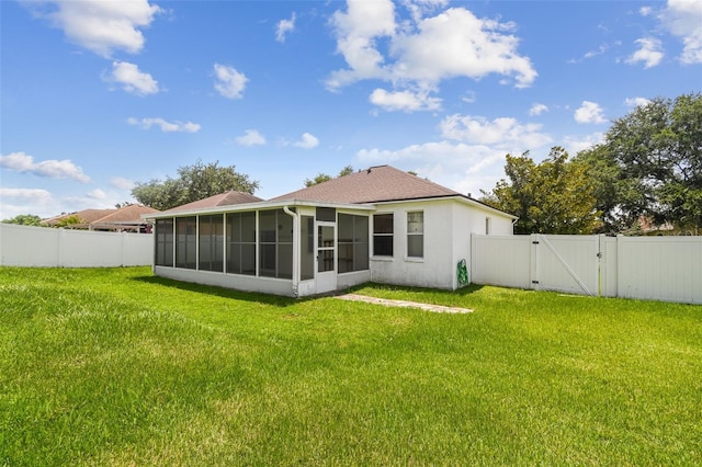 501 Royal Ridge St, Valrico, FL 33594 - back of property featuring a gate, a sunroom, a fenced backyard, and stucco siding