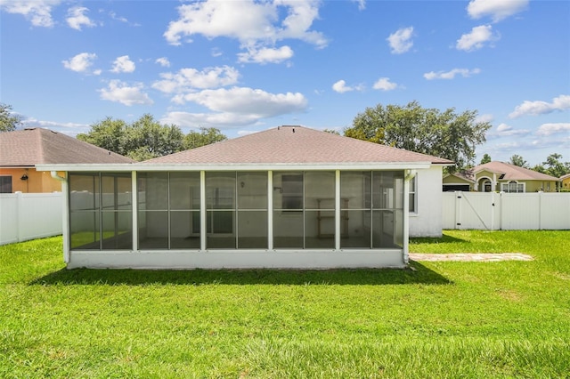 501 Royal Ridge St, Valrico, FL 33594 - rear view of property with a sunroom, a gate, a fenced backyard, and roof with shingles