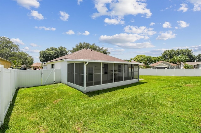 501 Royal Ridge St, Valrico, FL 33594 - back of property with a sunroom, a gate, and a fenced backyard