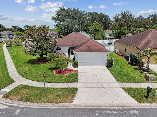 501 Royal Ridge St, Valrico, FL 33594 - mediterranean / spanish-style house featuring driveway, an attached garage, and stucco siding