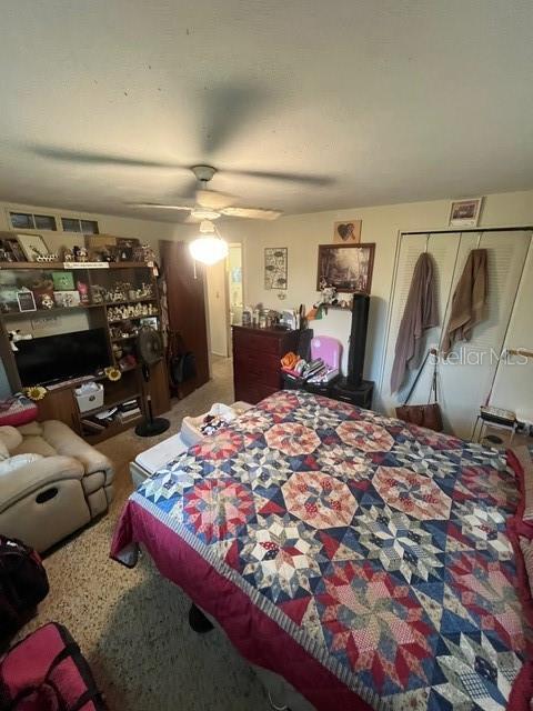 8946 Dream Way, Largo, FL 33773 - carpeted bedroom with a ceiling fan