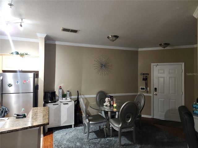 3713 Conroy Rd Unit 1922, Orlando, FL 32839 - dining space with ornamental molding and wood finished floors