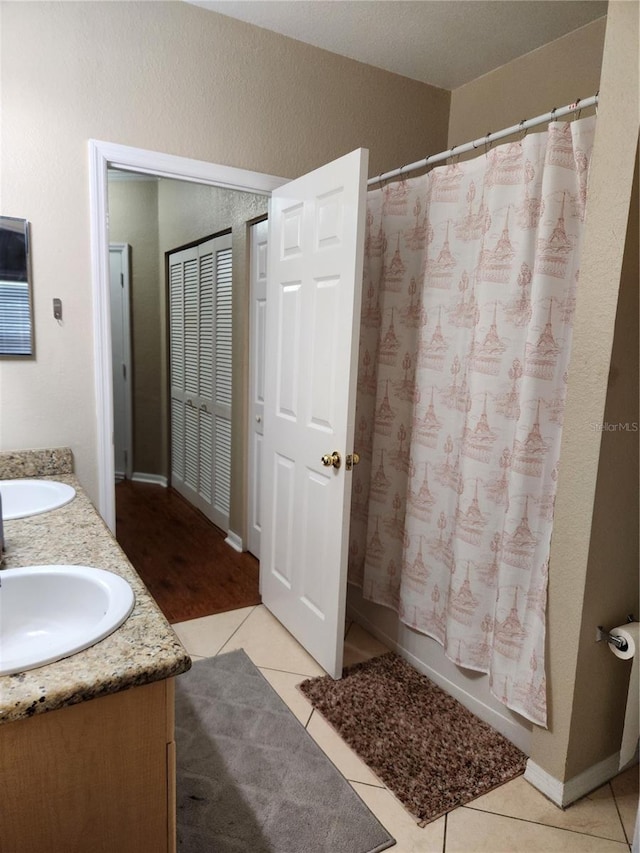 3713 Conroy Rd Unit 1922, Orlando, FL 32839 - bathroom featuring double vanity and tile patterned flooring