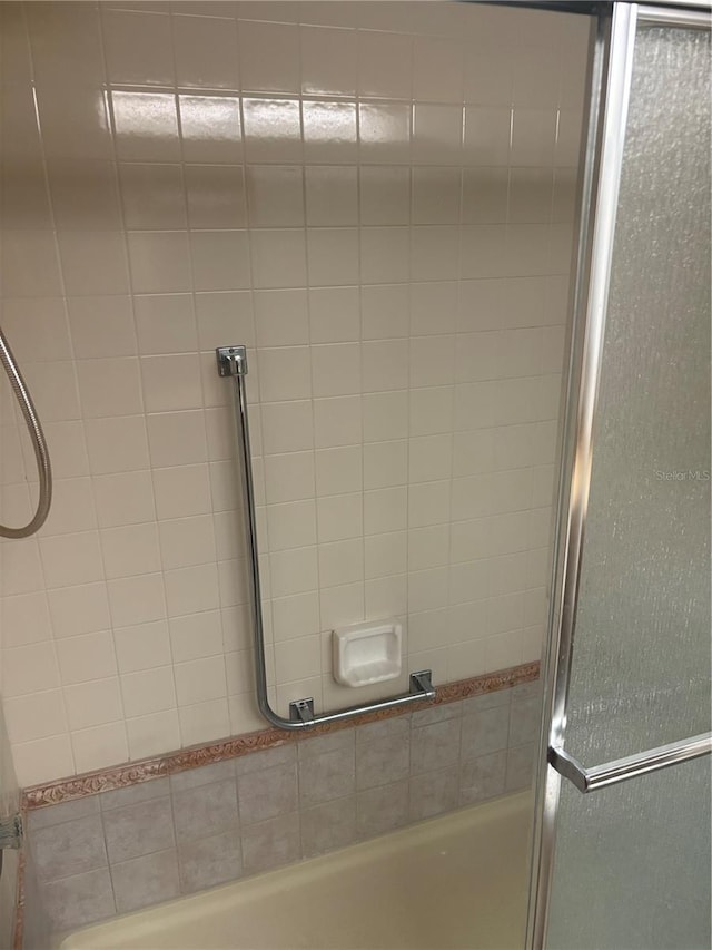 6125 Chesham Dr Unit 1, New Port Richey, FL 34653 - full bathroom with shower / bath combination with glass door