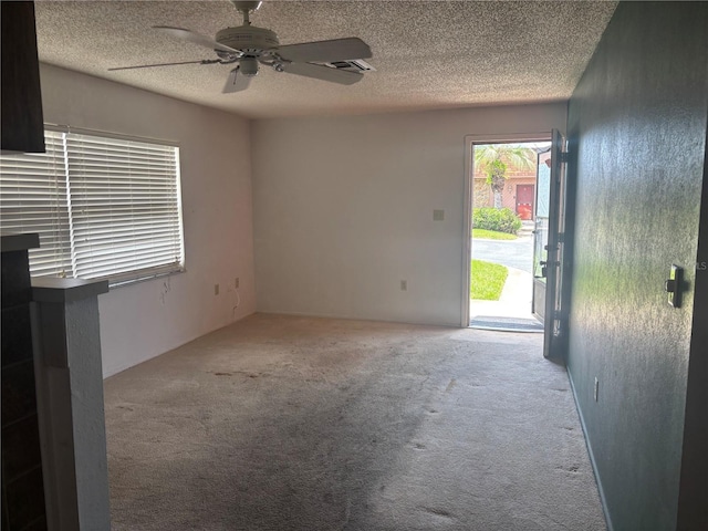 6125 Chesham Dr Unit 1, New Port Richey, FL 34653 - unfurnished living room featuring carpet, ceiling fan, and a textured ceiling
