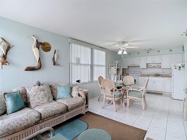4360 Tahitian Gardens Cir Unit H, Holiday, FL 34691 - living area featuring a ceiling fan and light tile patterned flooring