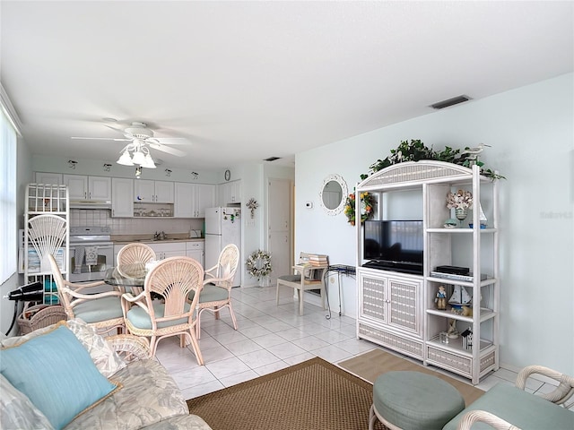 4360 Tahitian Gardens Cir Unit H, Holiday, FL 34691 - living area featuring a ceiling fan and light tile patterned floors