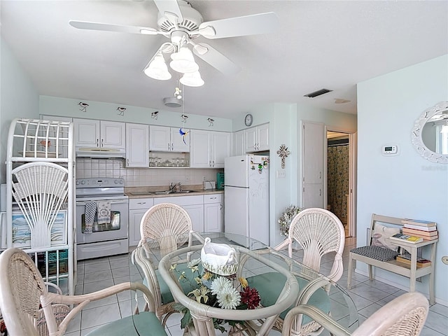 4360 Tahitian Gardens Cir Unit H, Holiday, FL 34691 - dining area featuring ceiling fan and light tile patterned flooring