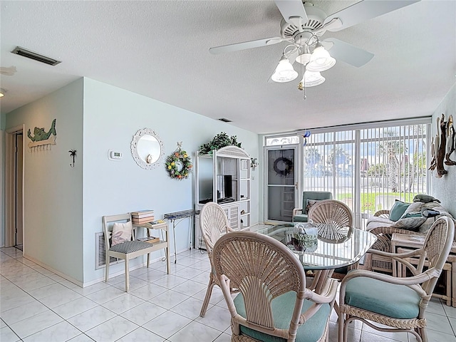 4360 Tahitian Gardens Cir Unit H, Holiday, FL 34691 - dining area with a ceiling fan, a textured ceiling, and light tile patterned floors