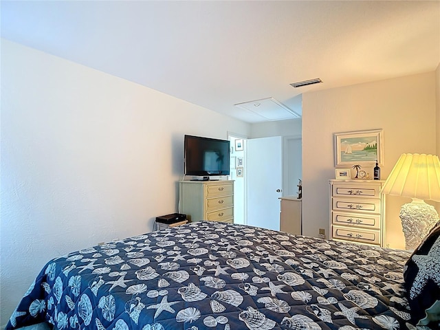 4360 Tahitian Gardens Cir Unit H, Holiday, FL 34691 - bedroom featuring attic access