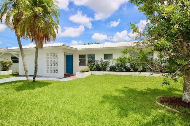 3643 Mainlands Blvd N, Pinellas Park, FL 33782 - ranch-style house featuring an attached garage, a front lawn, stucco siding, and a tiled roof