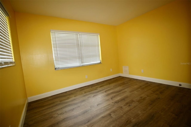 3643 Mainlands Blvd N, Pinellas Park, FL 33782 - spare room with dark wood-type flooring and baseboards