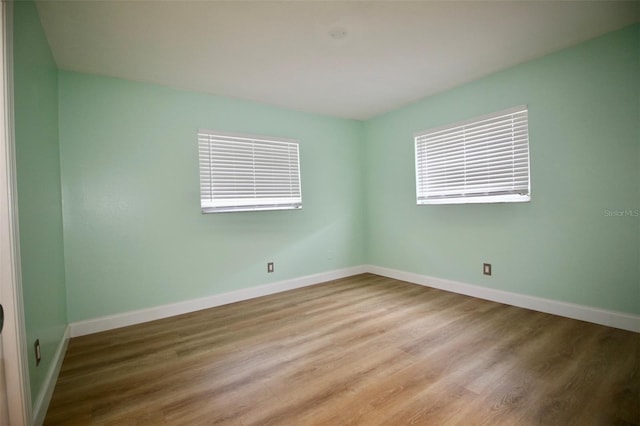 3643 Mainlands Blvd N, Pinellas Park, FL 33782 - empty room with wood finished floors and baseboards