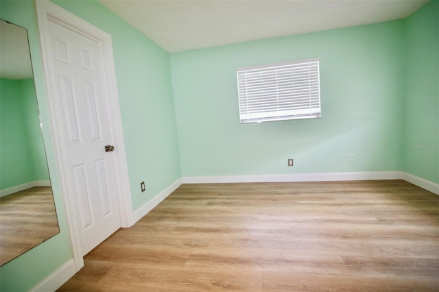 3643 Mainlands Blvd N, Pinellas Park, FL 33782 - unfurnished bedroom featuring light wood-type flooring and baseboards