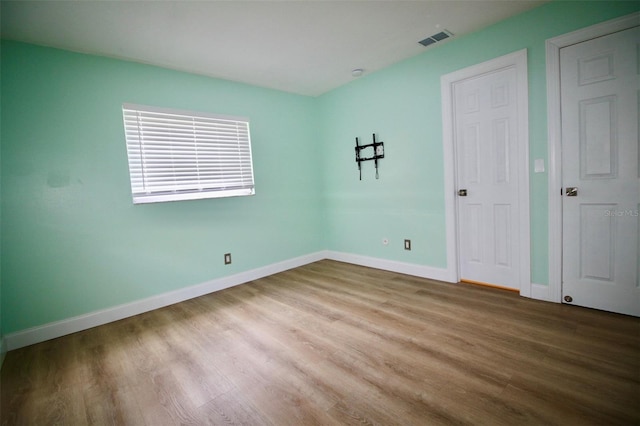 3643 Mainlands Blvd N, Pinellas Park, FL 33782 - unfurnished bedroom featuring wood finished floors and baseboards