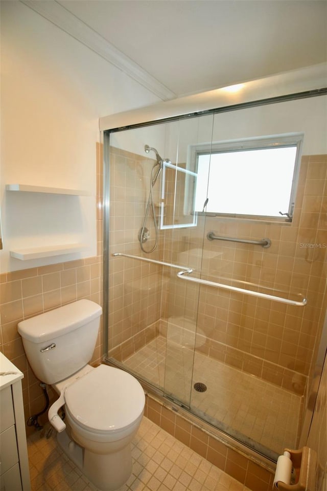 3643 Mainlands Blvd N, Pinellas Park, FL 33782 - bathroom featuring vanity, a stall shower, tile patterned floors, and tile walls