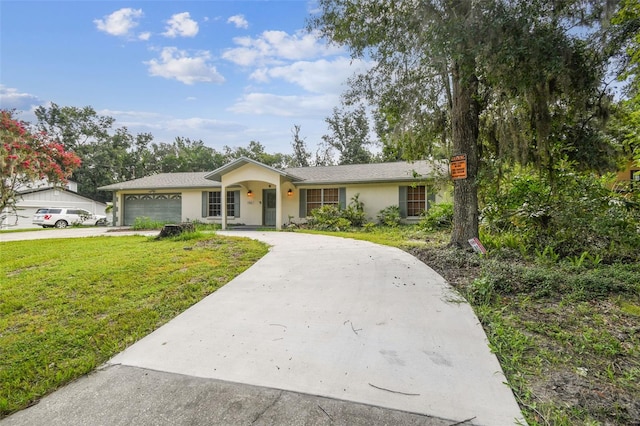 4514 John Moore Rd, Brandon, FL 33511 - ranch-style home featuring driveway, a garage, a front lawn, and stucco siding