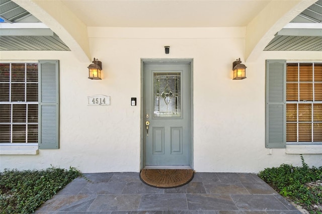 4514 John Moore Rd, Brandon, FL 33511 - entrance to property featuring stucco siding and a porch
