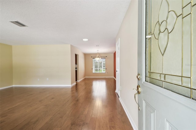 4514 John Moore Rd, Brandon, FL 33511 - entrance foyer featuring dark wood-style floors, a textured ceiling, and recessed lighting